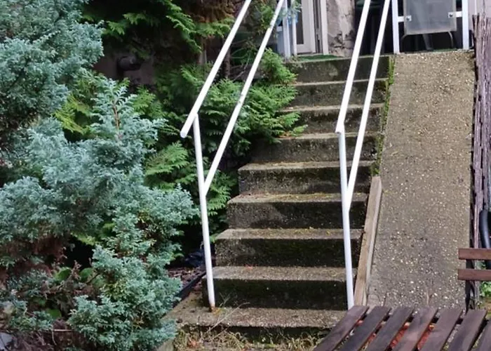 Gazde/Camere de închiriat Central Apartman *